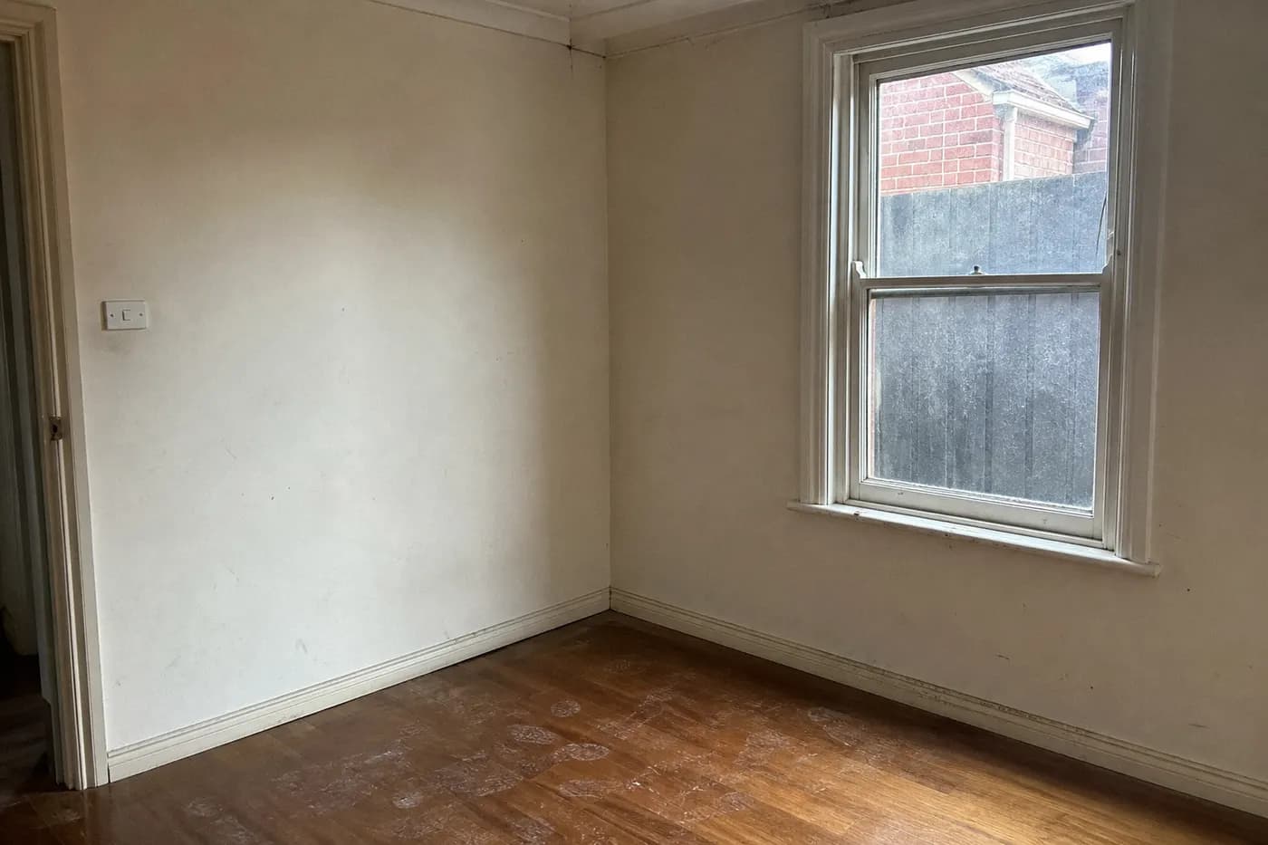 Dusty empty living room before end of lease cleaning