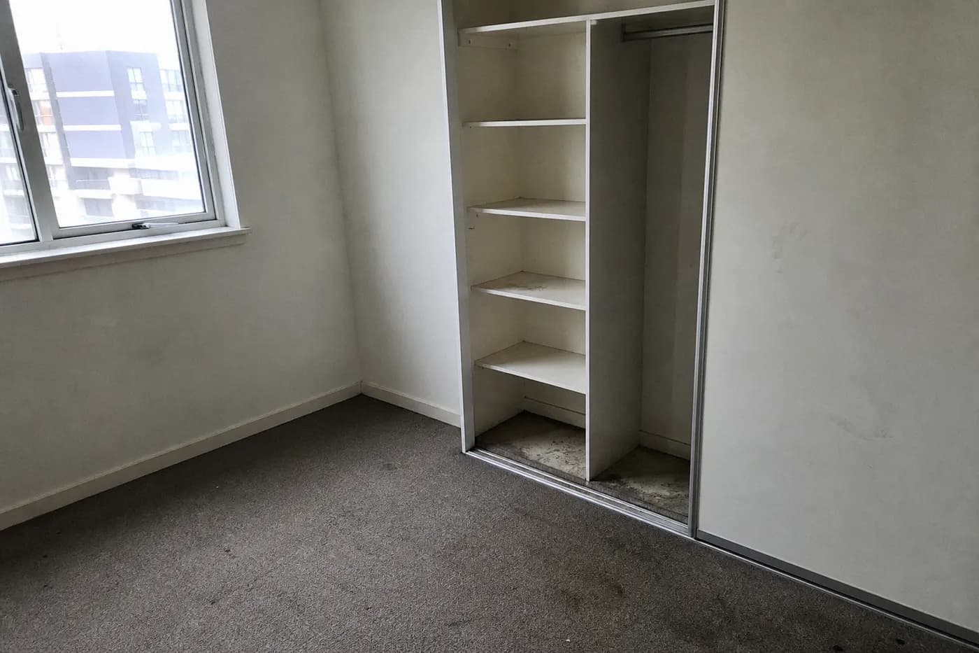 Dusty wardrobe interior before bond cleaning