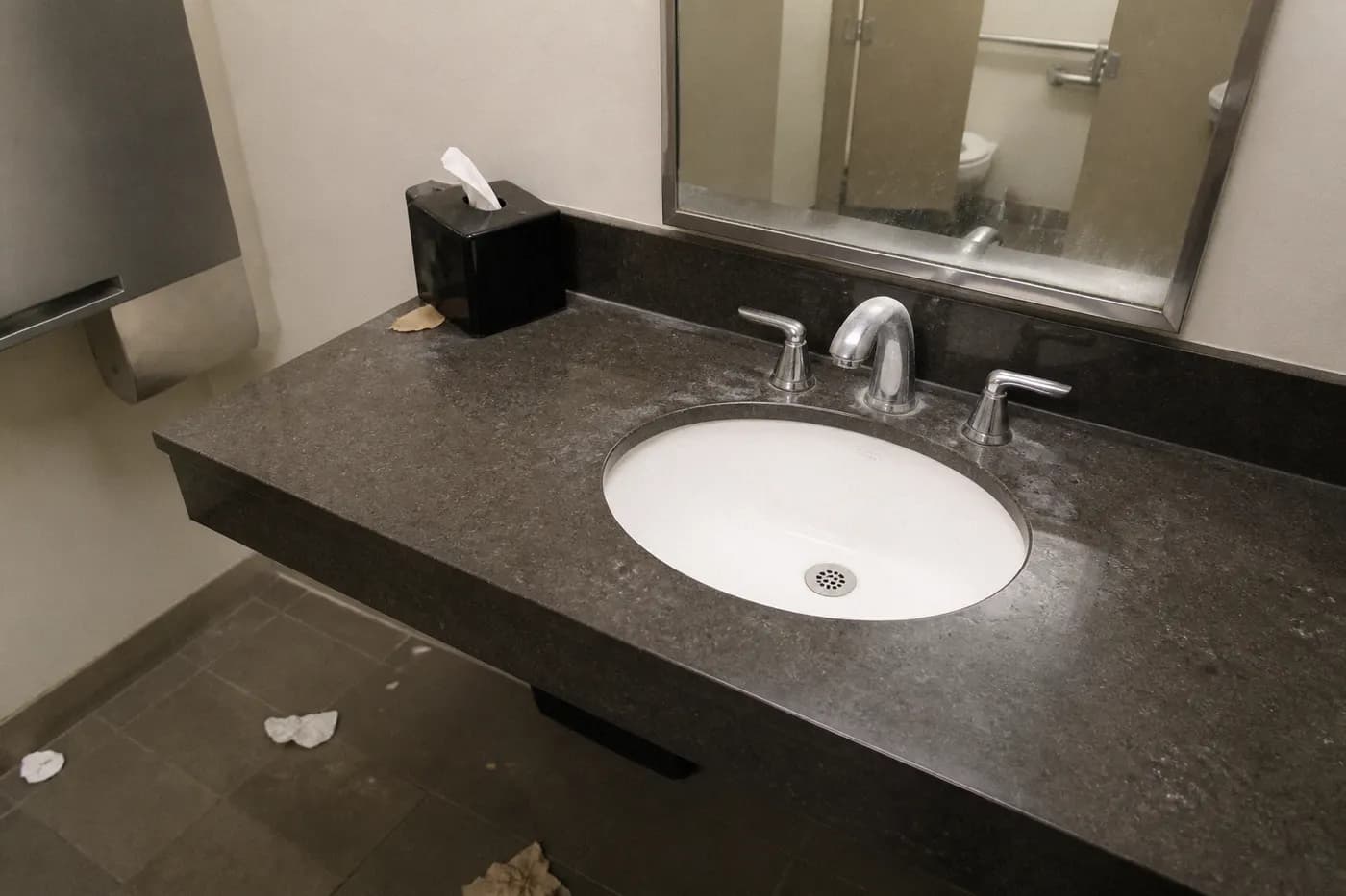 Office bathroom basin before cleaning