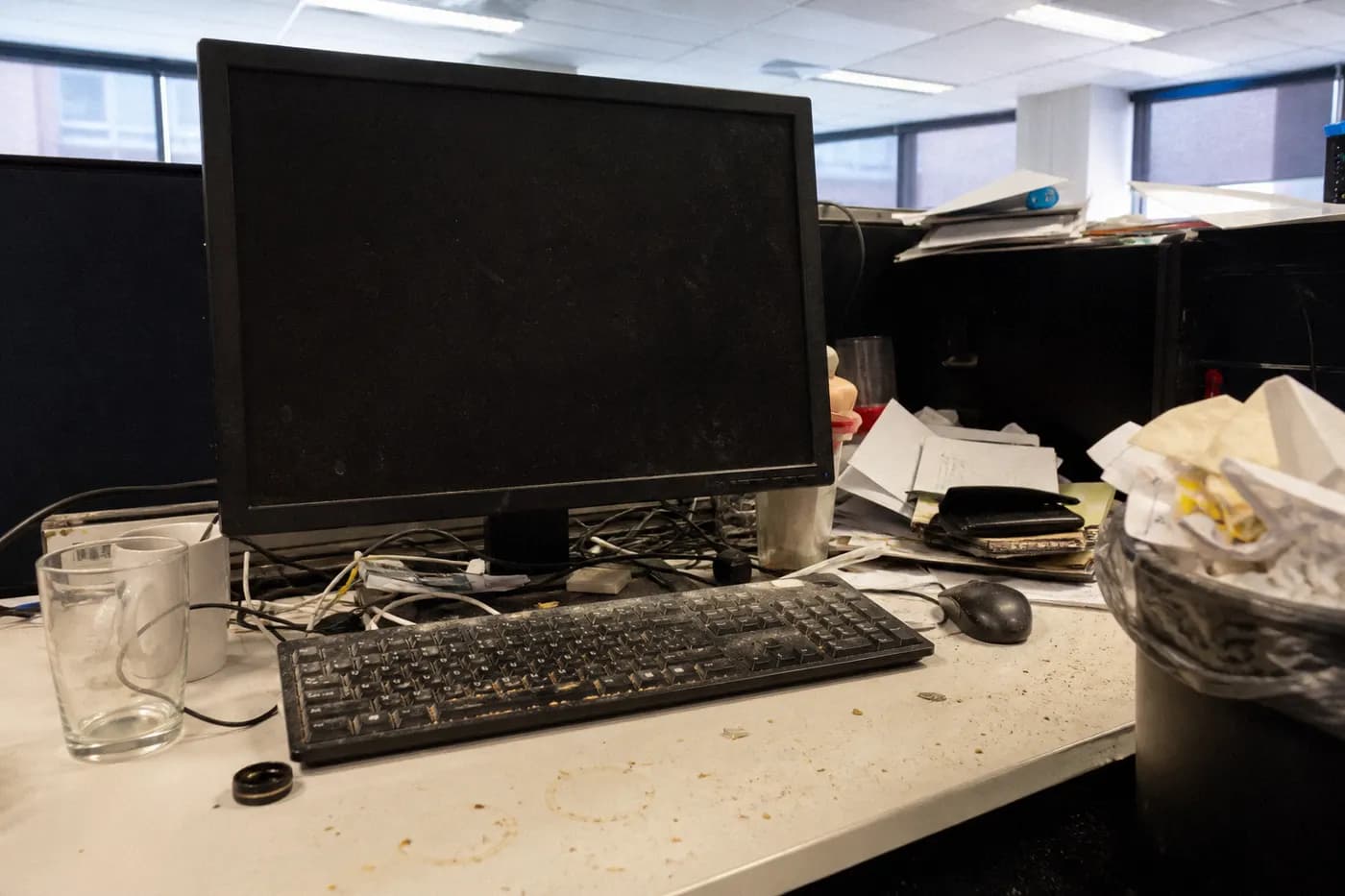 Messy office desk before commercial cleaning