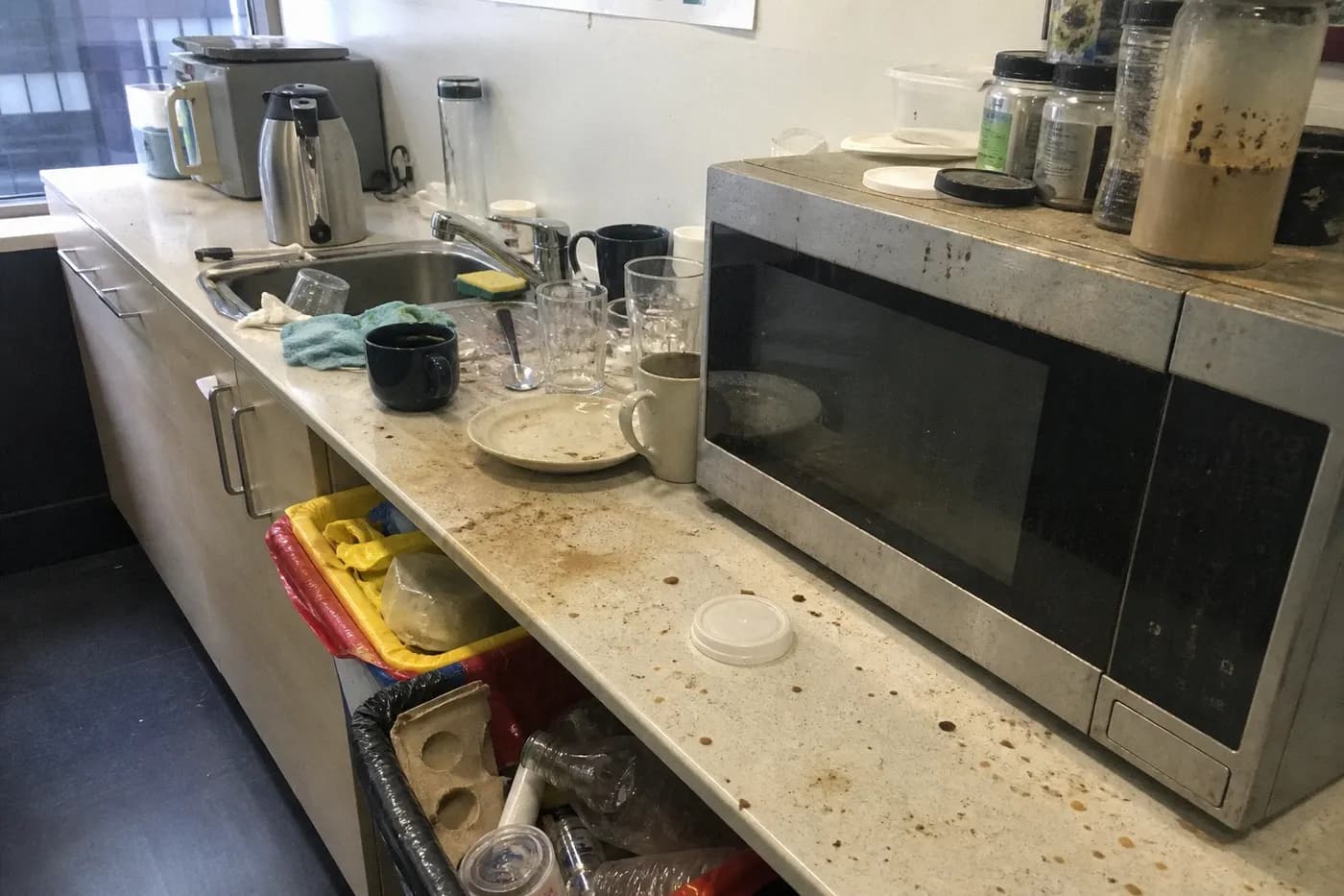 Messy office kitchenette before cleaning